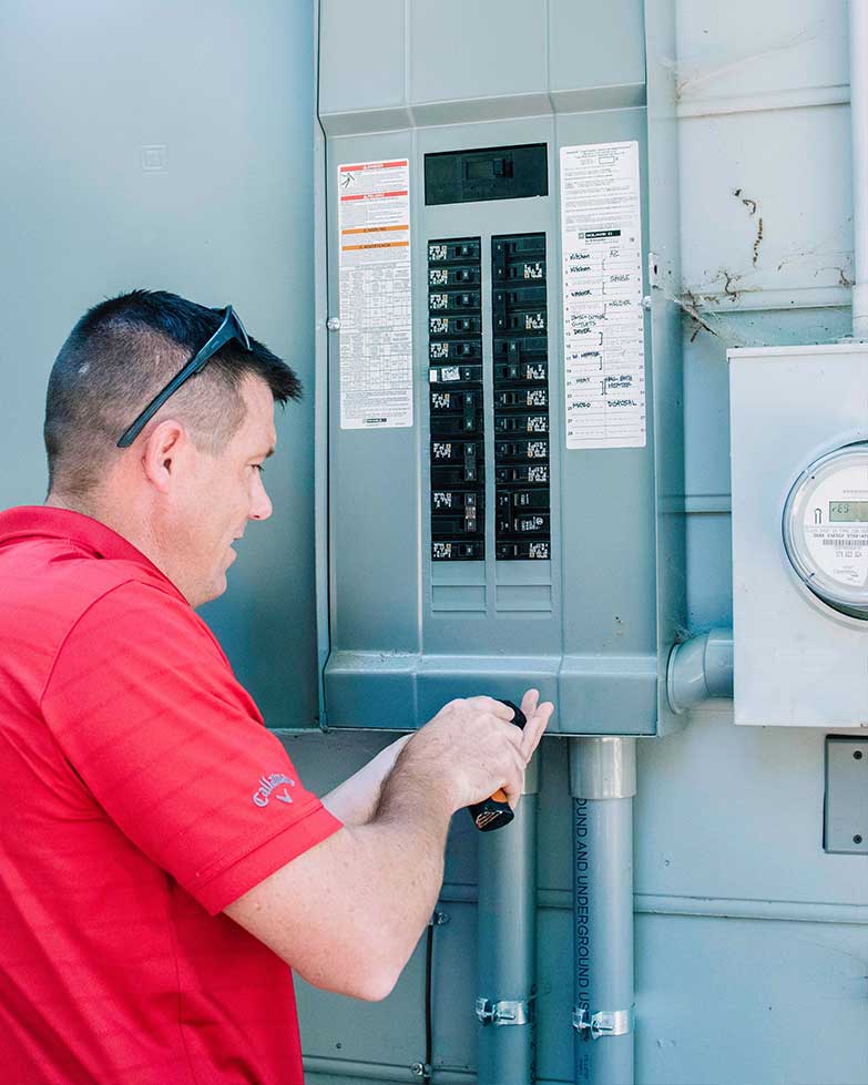 How to prepare for a home inspection - inspector checking breaker box.